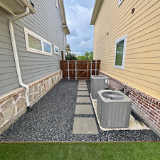 Backyard-Redesign-with-Artificial-Turf-Putting-Green-Landscape-Rock-Installation-in-McKinney-TX 3